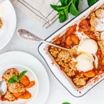 Gluten-Free Peach Cobbler: The Ultimate Summer Dessert for Comfort and Joy 11 Gluten-free peach cobbler in a vintage baking dish on a kitchen table
